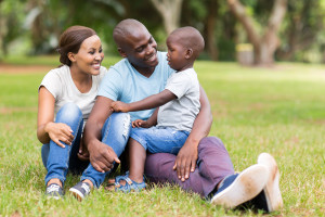 young african family sitting outdoors
